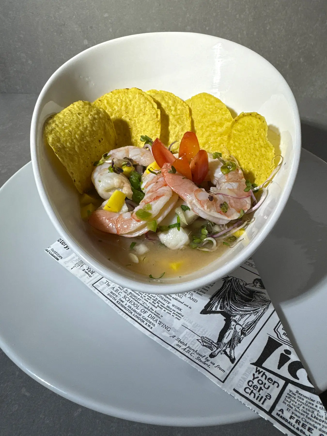 Shrimp ceviche served in a bowl with corn chips